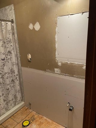 Bathroom renovation with drywall installation.